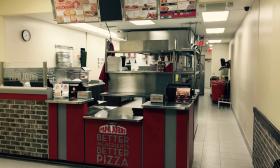 The counter space inside Papa John's Pizza