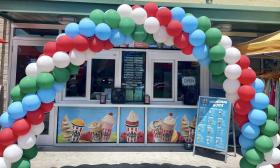 A balloon archway on the outside of Rita's