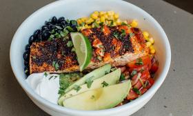 A salmon bowl with an assortment of toppings