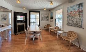 Indoor dining with a fireplace in the corner