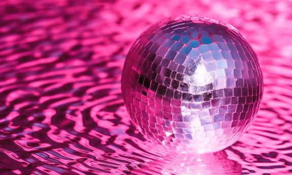 A silver disco ball, creating waves in pink light, by amrets007