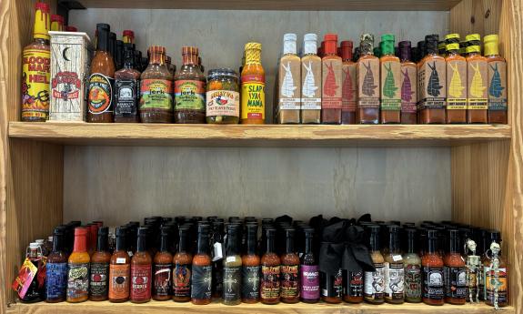 Hot sauces lining the shelves