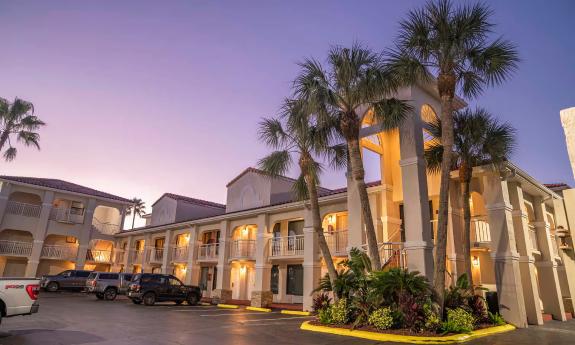 The exterior of Best Western Seaside at dusk