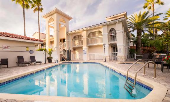 The pool at a hotel with a spanish theme