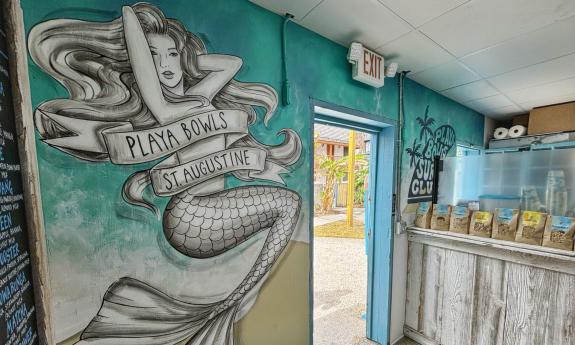 A mermaid mural inside the eatery