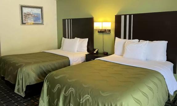 This two-bed room at Quality Inn in Elkton has a green decor