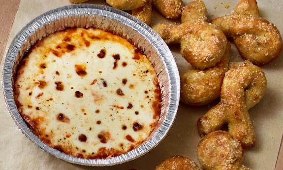 Bread twists and a side of cheese dip