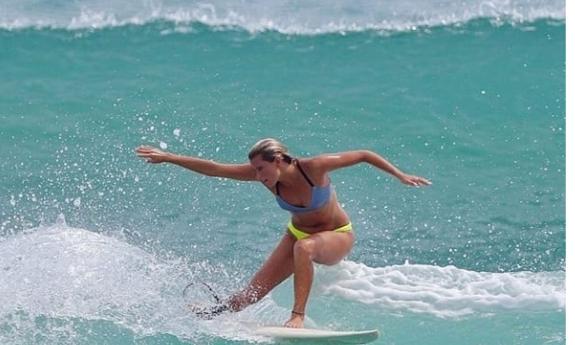 Musician Lucy Spotts, surfing