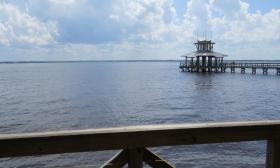 The covered short and long pier overlooking the water