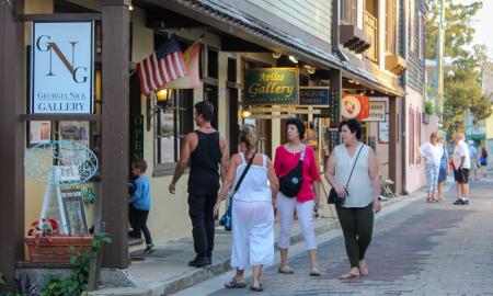 A group of visitors walking into the Georgia Nix Gallery during First Friday Art Walk in St. Augustine