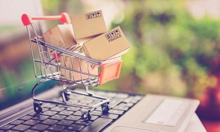 Boxes in a shopping cart on a laptop computer