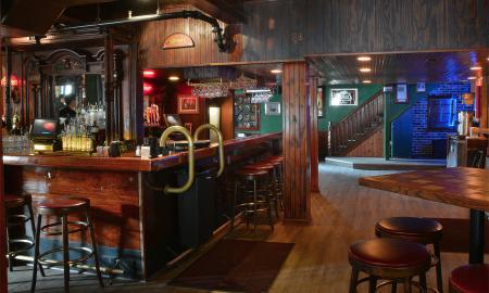 The downstairs bar with an old-timey, wooden interior