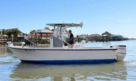 Brian Walker driving his boat