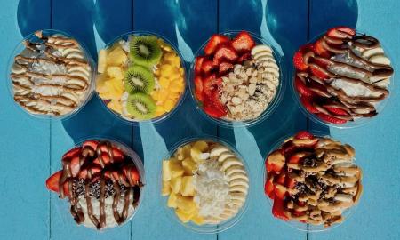 An assortment of bowls served with toppings galore