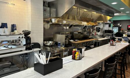 The counter overlooking the kitchen at Nadine's Cafe