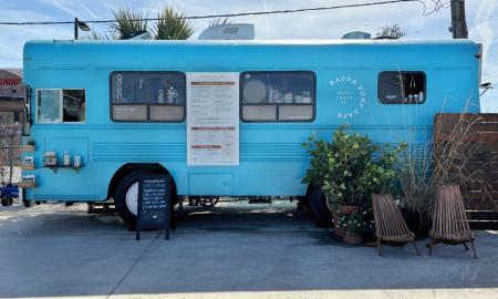 The exterior of Ragga Surf Cafe's blue bus