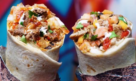 A stuffed burrito with various ingredients