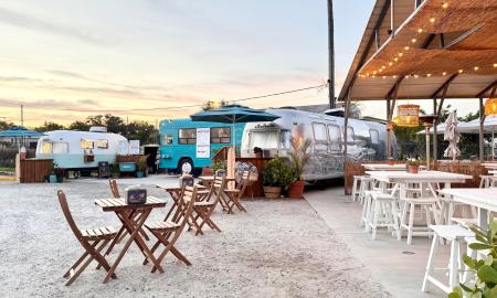 Ragga Surf Cafe at dusk, with seating and lights for the night