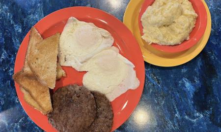 Toast, eggs, sausage, and grits
