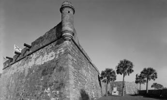 The southeast corner of the Castillo de San Marcos with cannons peeking out the left side wall in 1933