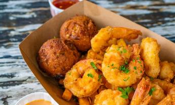 Timoti's serves the regional favorite of fried locally-caught shrimp and hushpuppies