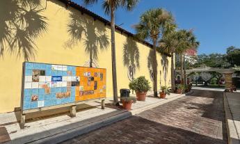 The entrace of Aviles Street and the tile mural as seen from along the street near the Spanish Hospital Museum