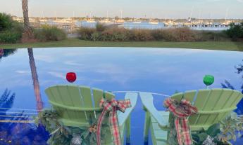 A home patio and pool area, overlooking the Matanzas River, decorated for the holidays