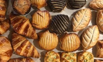 Various desserts laid out on a baking sheet