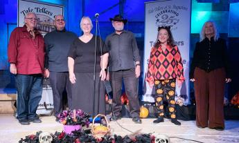 Members of a story-telling group, on stage after a fall performance