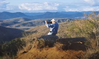 Sebastião Salgado taking a photo of the landscape