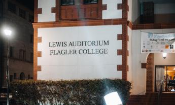 Lewis Auditorium lit by a spotlight at the 2024 St. Augustine Film Festival