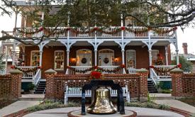 The St. Augustine Lighthouse lit for the holidays in the early evening