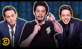 Pete Davidson performs comedic routines on stage. 