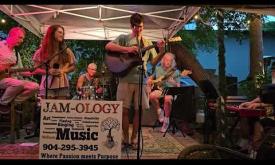 "Long Train Running," written by the Doobie Brothers and performed by musicians and a singer from Jam-ology