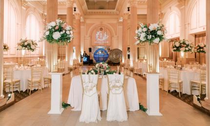 A wedding reception arranged at the Treasury with white table coverings 