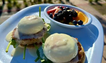 Open for breakfast, Crabby's Beachside offers Eggs Benedict with a side of fruit