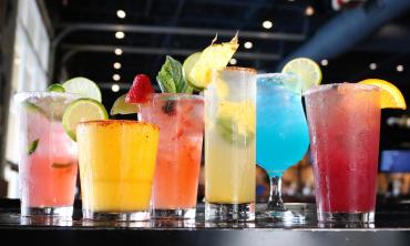 A line of different flavored cocktails