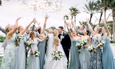 This wedding party at Hammock Beach Golf Resort and Spa react to hundreds of rose petals