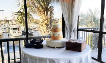 Wedding cake table situated in the HarborView Banquet Room above the Kingfish Grill