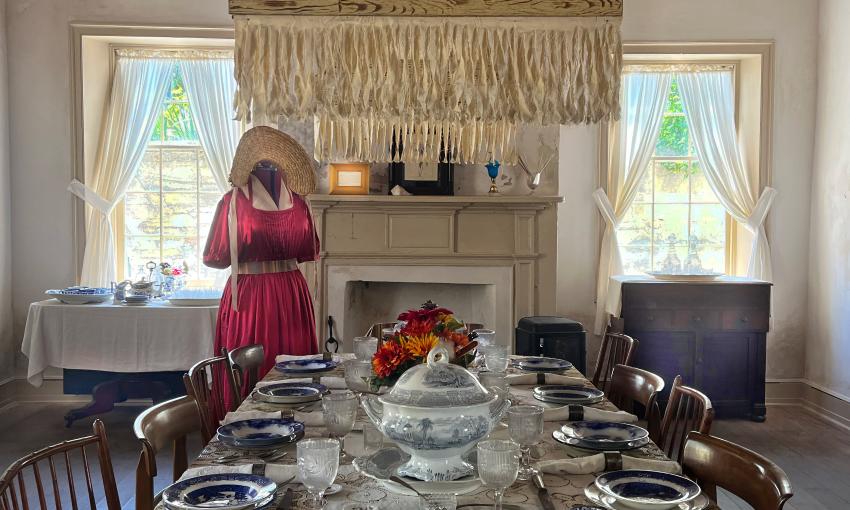 An historic dress on display in the dining room of the Ximenez-Fatio House Museum
